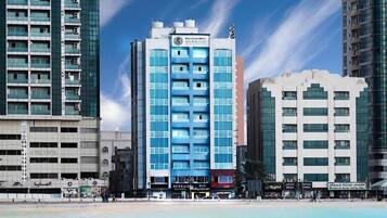 Family Room, 2 Bedrooms, Partial Sea View | 1 bedroom, in-room safe, desk, iron/ironing board