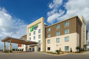 A Holiday Inn Express hotel with a modern design, featuring a covered entrance and a clear sky. - Holiday Inn Express & Suites Bay City by IHG (Bay City)