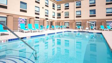 Outdoor pool, open 8 AM to 10 PM, pool loungers
