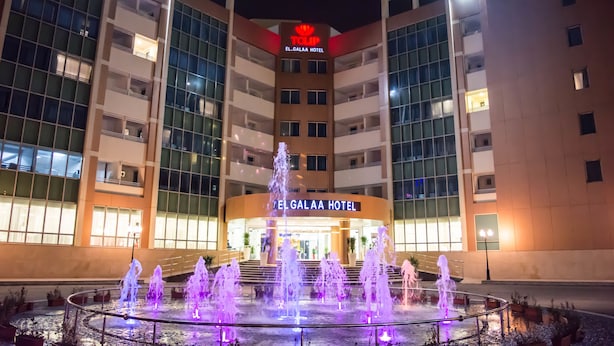 The exterior of the El Galala Hotel with a central fountain and illuminated signage. - Tolip El Galaa Cairo Hotel (Cairo)