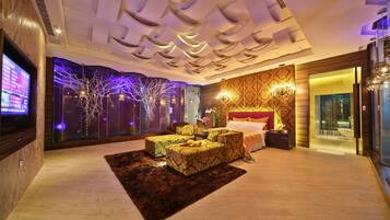 Premium bedding, down comforters, free minibar, desk