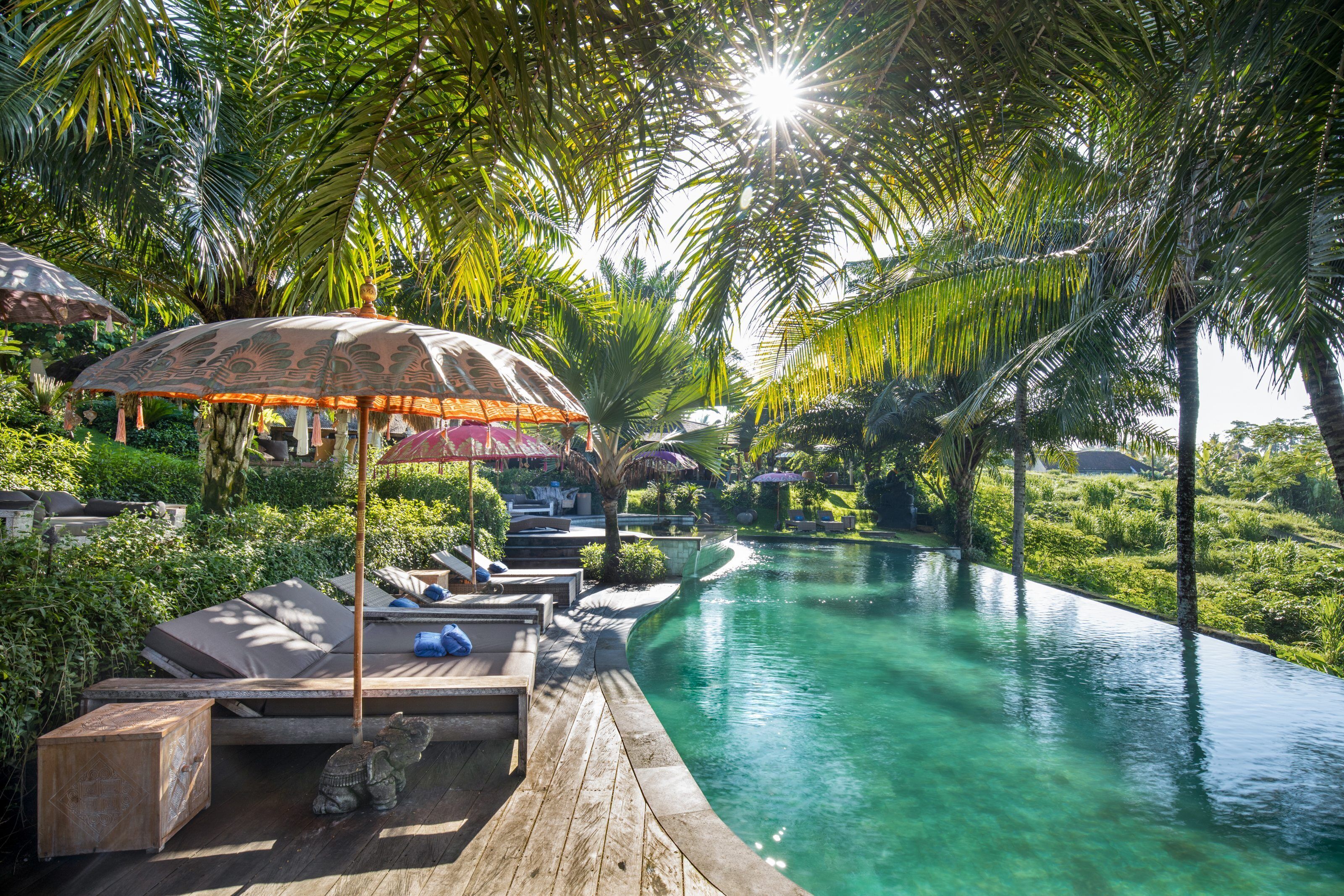 outdoor pool, open 7:00 am to 7:00 pm, pool umbrellas, pool loungers