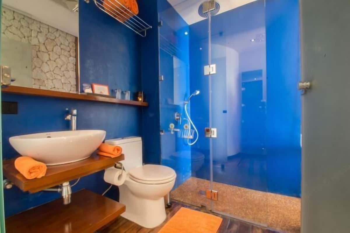 Bathroom | Shower, rainfall showerhead, hair dryer, bathrobes
