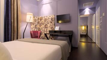 Premium bedding, down comforters, free minibar, in-room safe