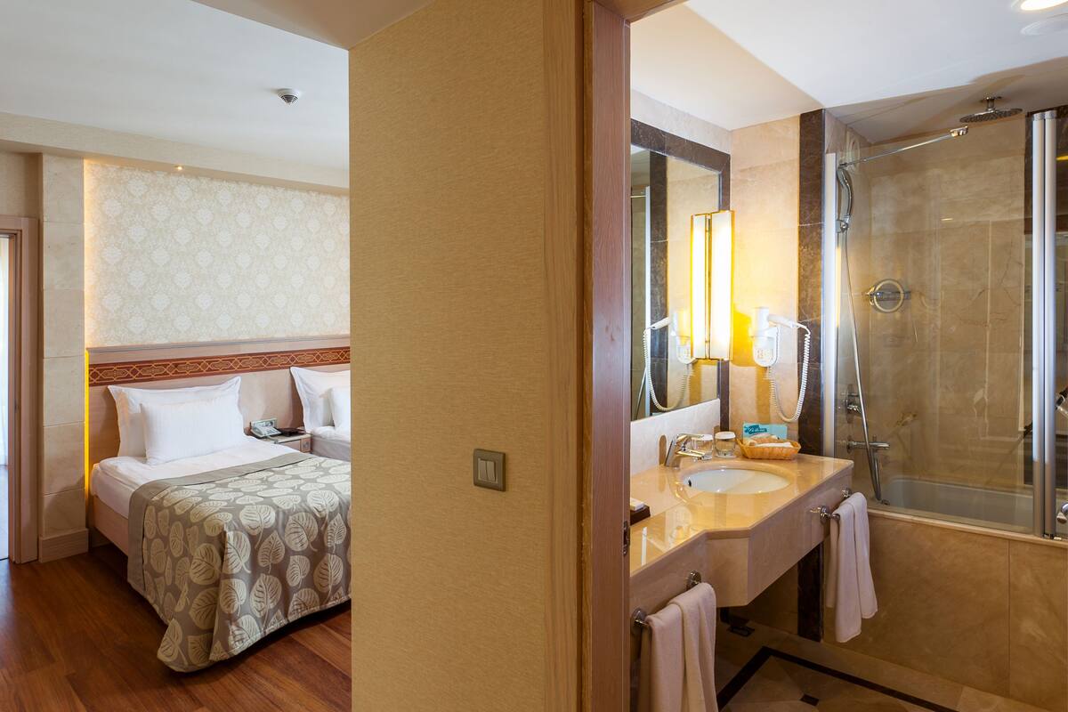 Deluxe Room, 2 Bedrooms | Living area | LCD TV