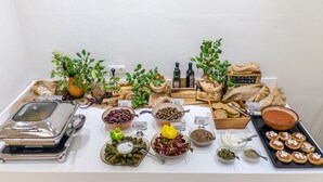 A buffet table with various food items, including olives, cheeses, and bread. - Solimar Ruby (Hersonissos)