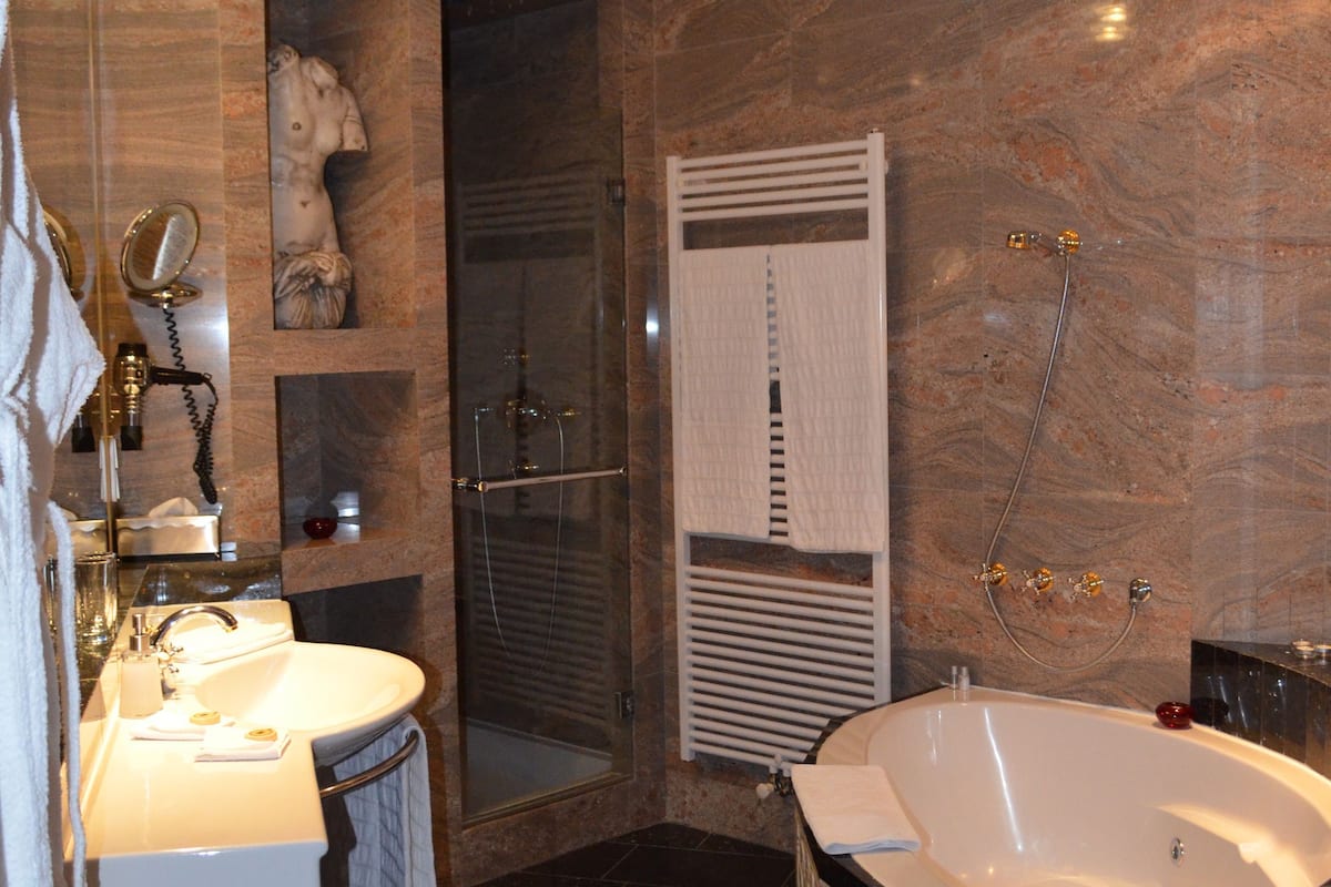 exclusive suite, 1 king bed, smoking | bathroom | separate bathtub and shower, jetted bath, free toiletries