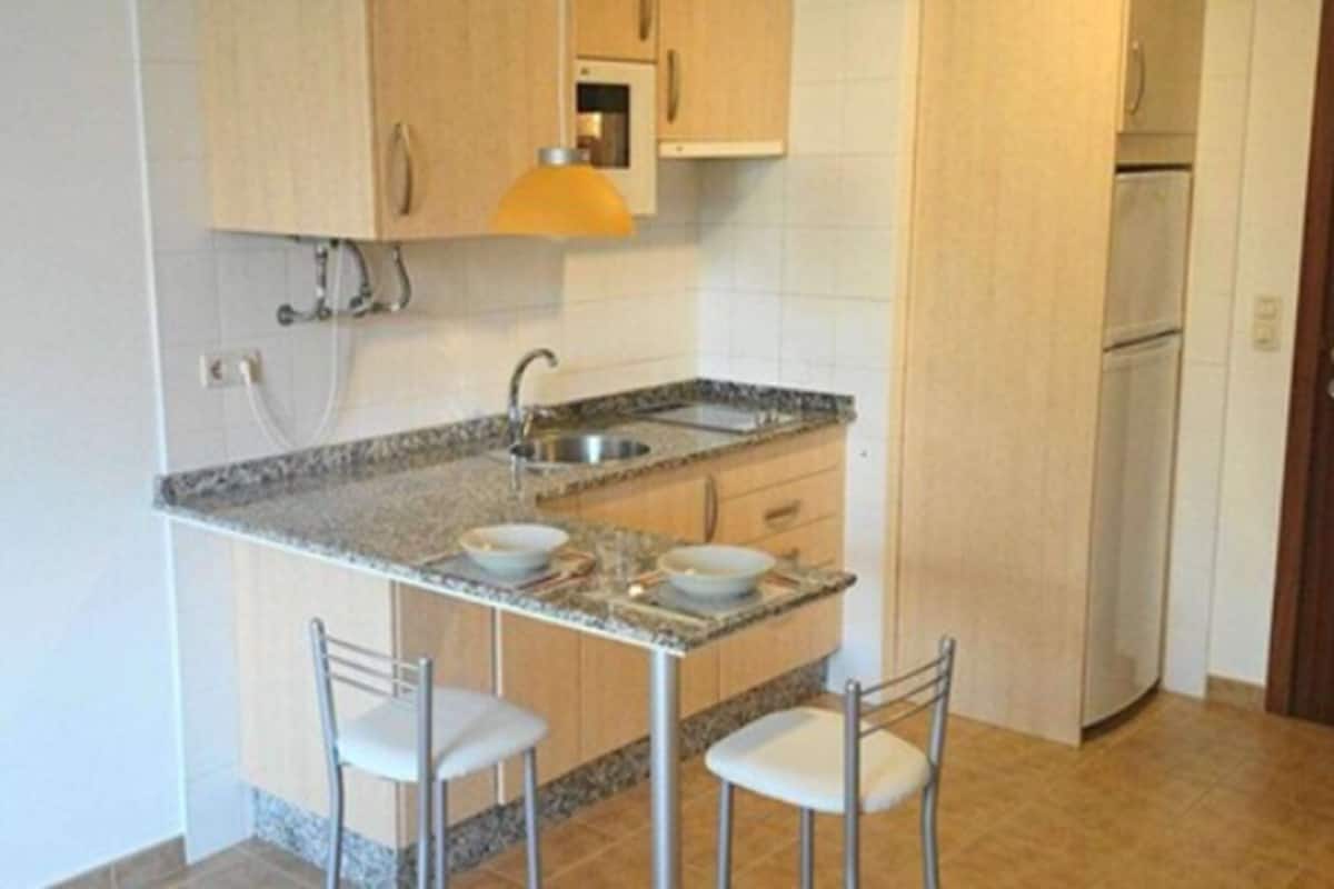 full-sized fridge, microwave, stovetop, coffee/tea maker