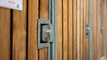 A close-up of a door with a metal lock and a keyhole.