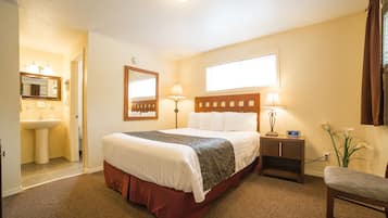 Economy Room, 1 Queen Bed, Refrigerator | Blackout curtains, iron/ironing board, free WiFi, bed sheets