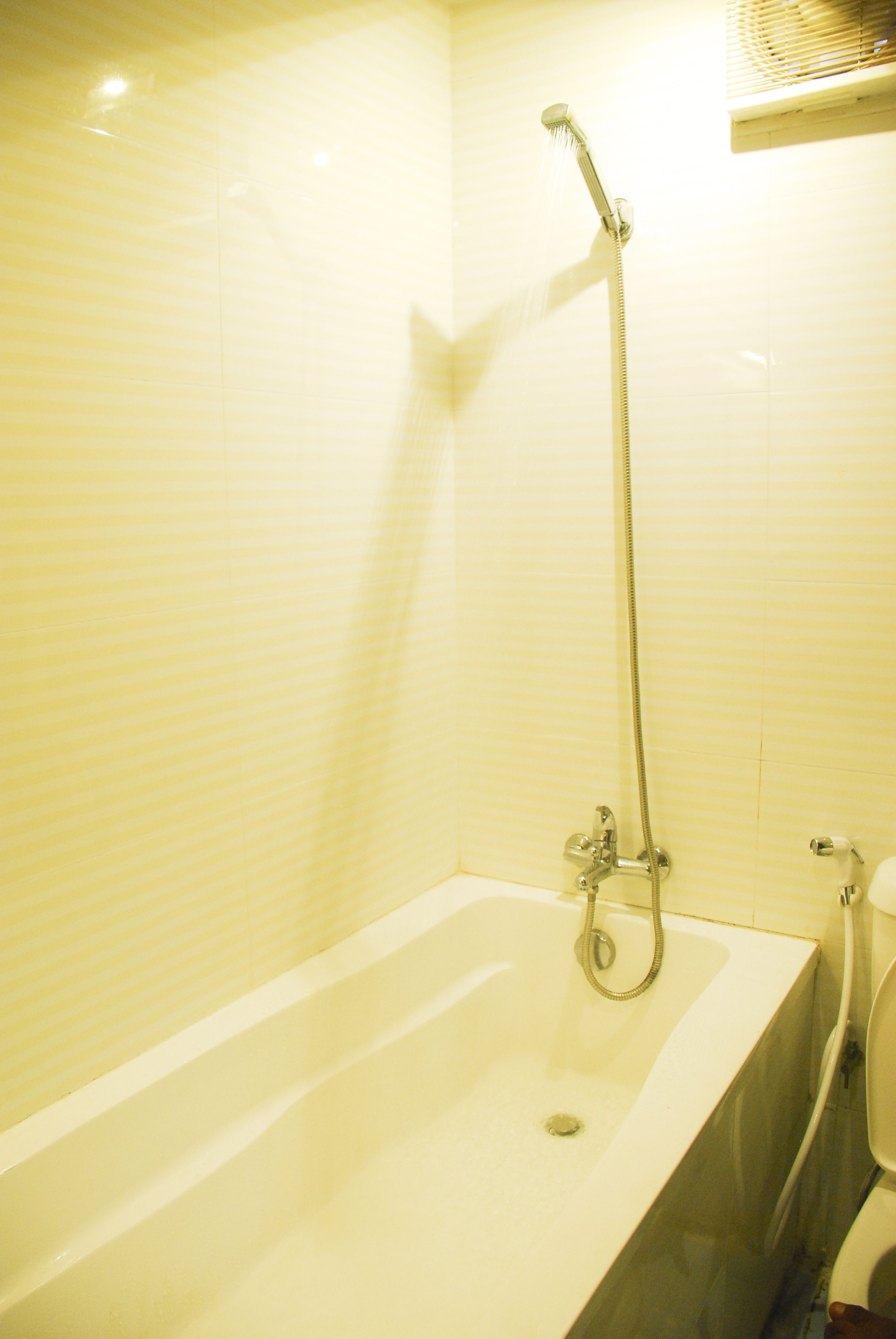 deluxe room | bathroom | shower, free toiletries, hair dryer, slippers
