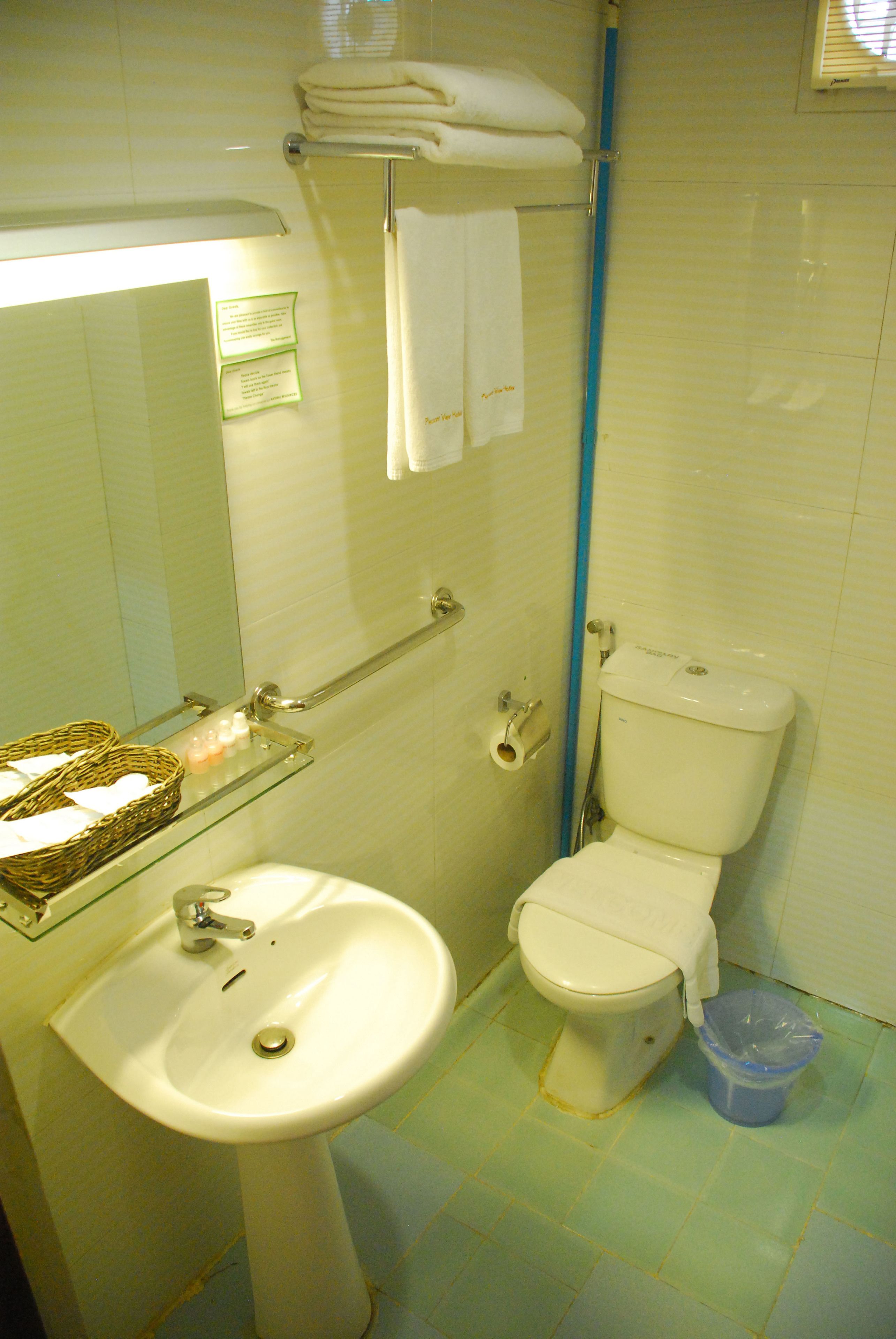 deluxe room | bathroom | shower, free toiletries, hair dryer, slippers