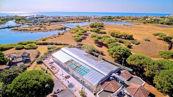 Experience the serene coastal setting with a view of the marina and well-maintained gardens.