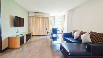 Suite, Kitchenette, City View | Living area | 53-inch Smart TV with cable channels