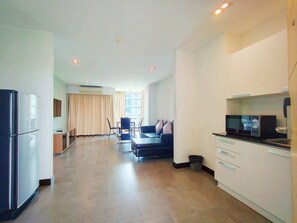 Suite, Kitchenette, City View | Living area | 53-inch Smart TV with cable channels - 14 Living (Bangkok)