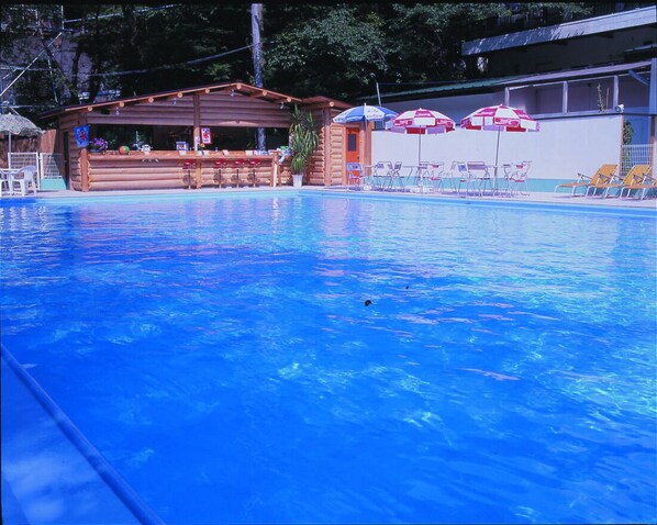 Outdoor pool, open 10 AM to 5 PM, pool umbrellas
