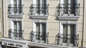 A multi-story hotel with balconies, a staircase, and a sign reading "ABEL HOTEL". - Abel Hotel (Istanbul)