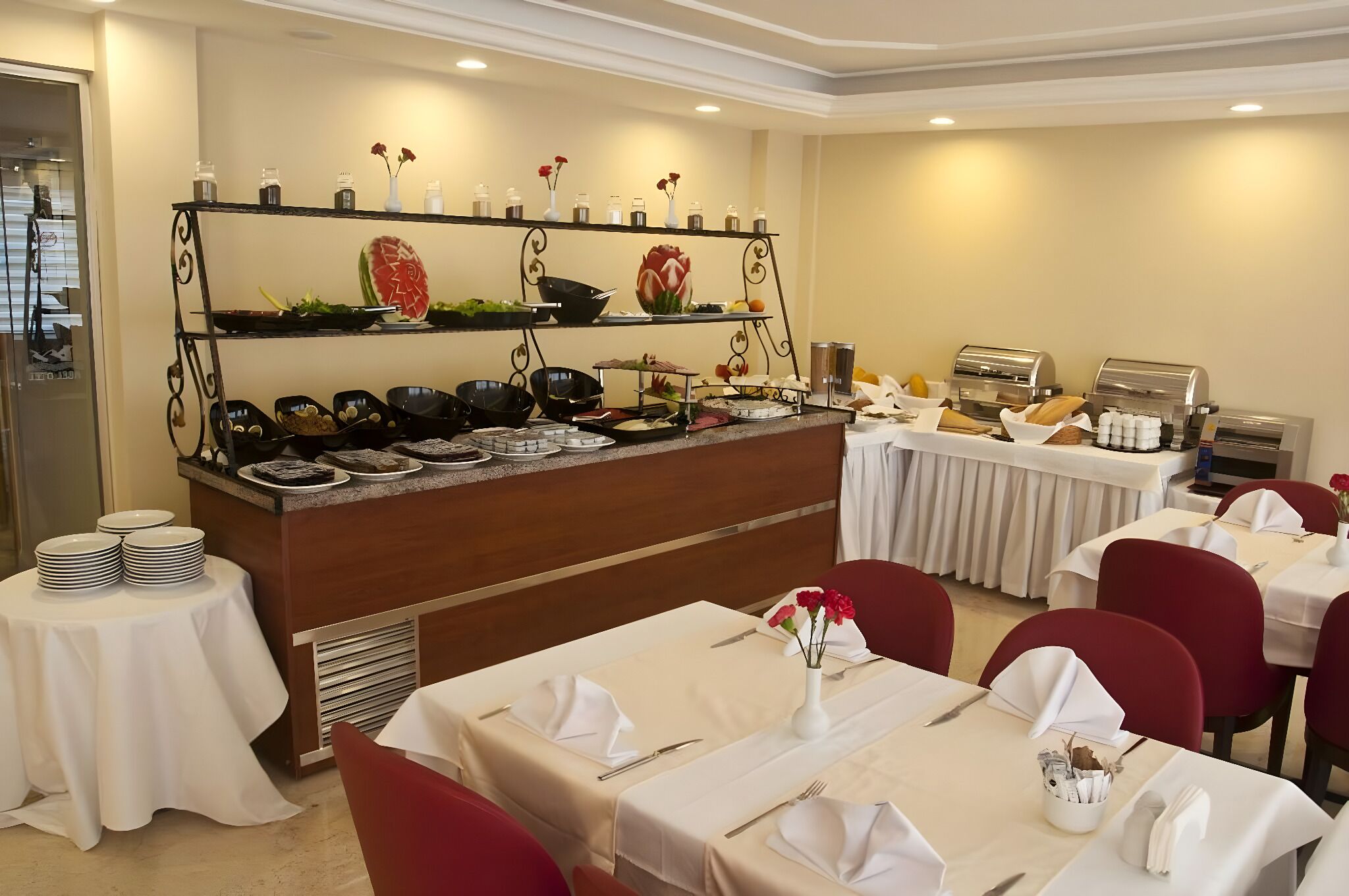A buffet setup with various food items and a coffee station.