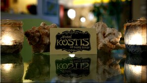 A sign for Hotel Kostis with a contact number. - Hotel Kostis (Skiathos)