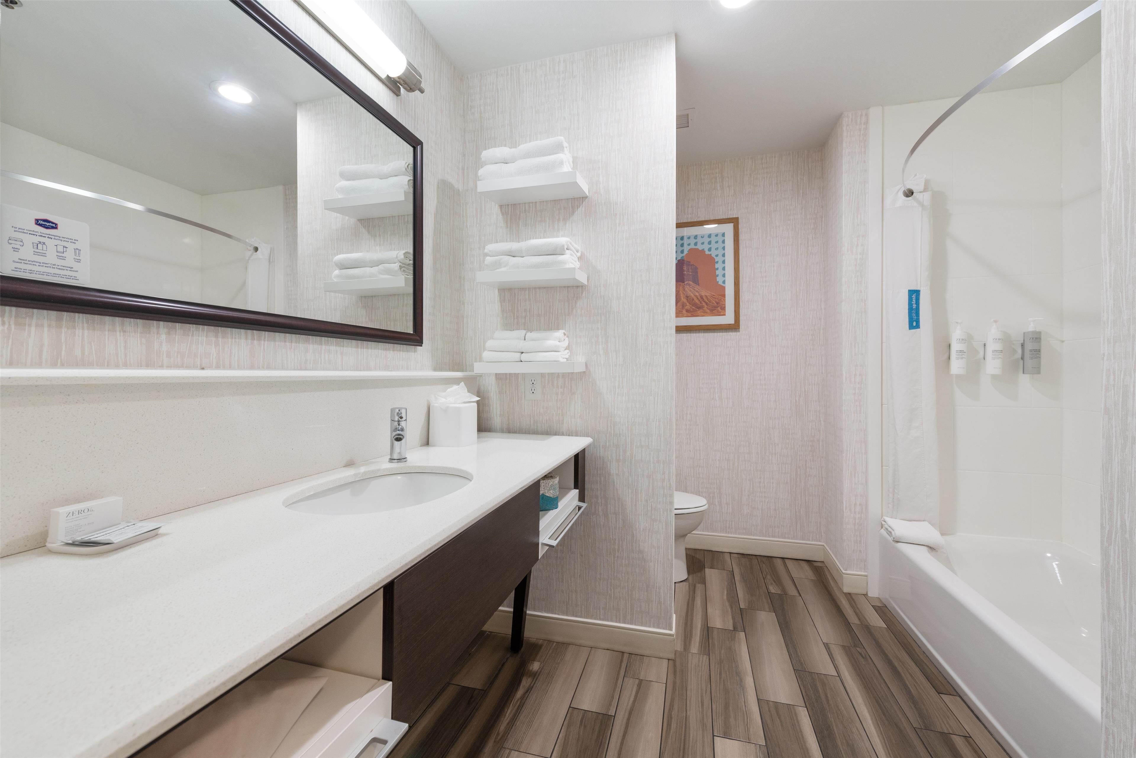 room, 2 queen beds, refrigerator & microwave | bathroom shower