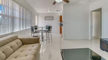 Apartment, 1 Bedroom | Living room | Flat-screen TV