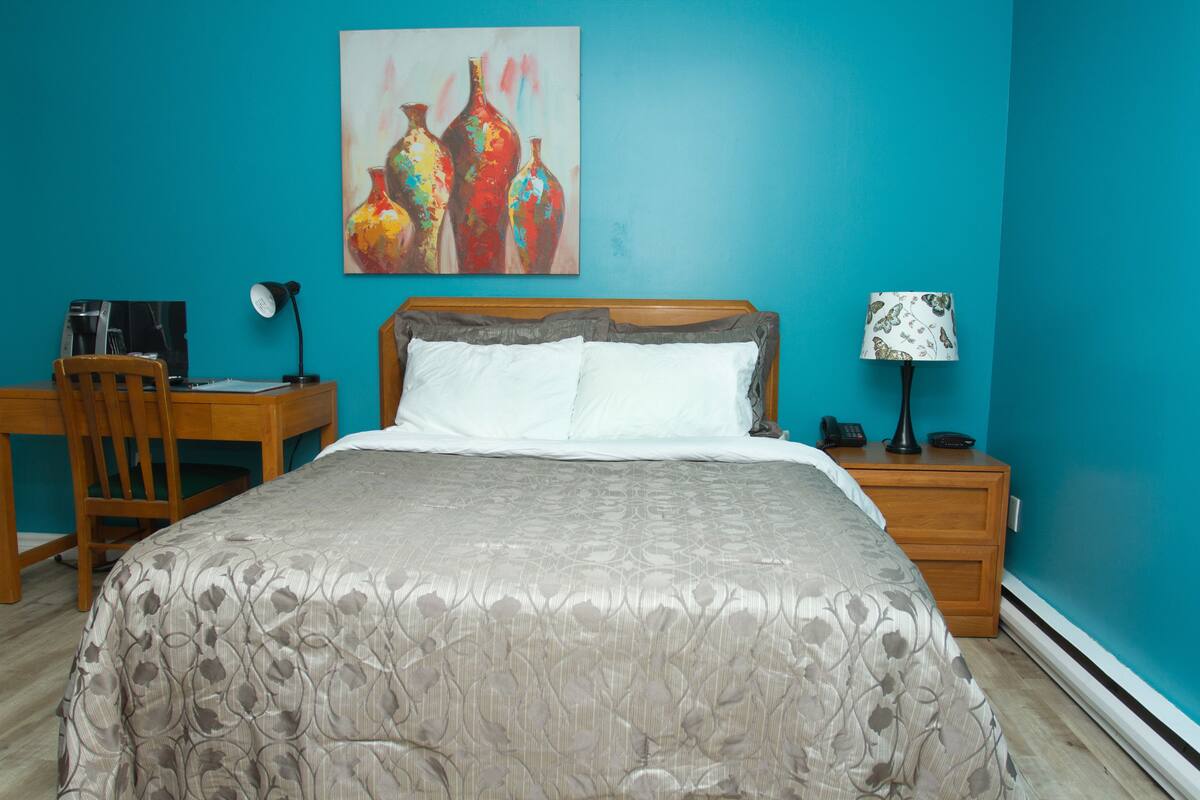 Comfort Room, 1 Queen Bed, Kitchenette | 1 bedroom, iron/ironing board, free WiFi, bed sheets