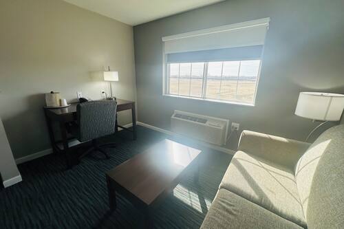 Premium bedding, desk, laptop workspace, blackout drapes