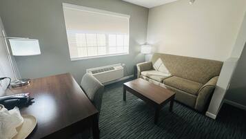 Premium bedding, desk, laptop workspace, blackout drapes