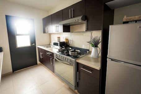 Premium Villa, 3 Bedrooms | Private kitchenette | Full-size fridge, microwave, stovetop, coffee/tea maker