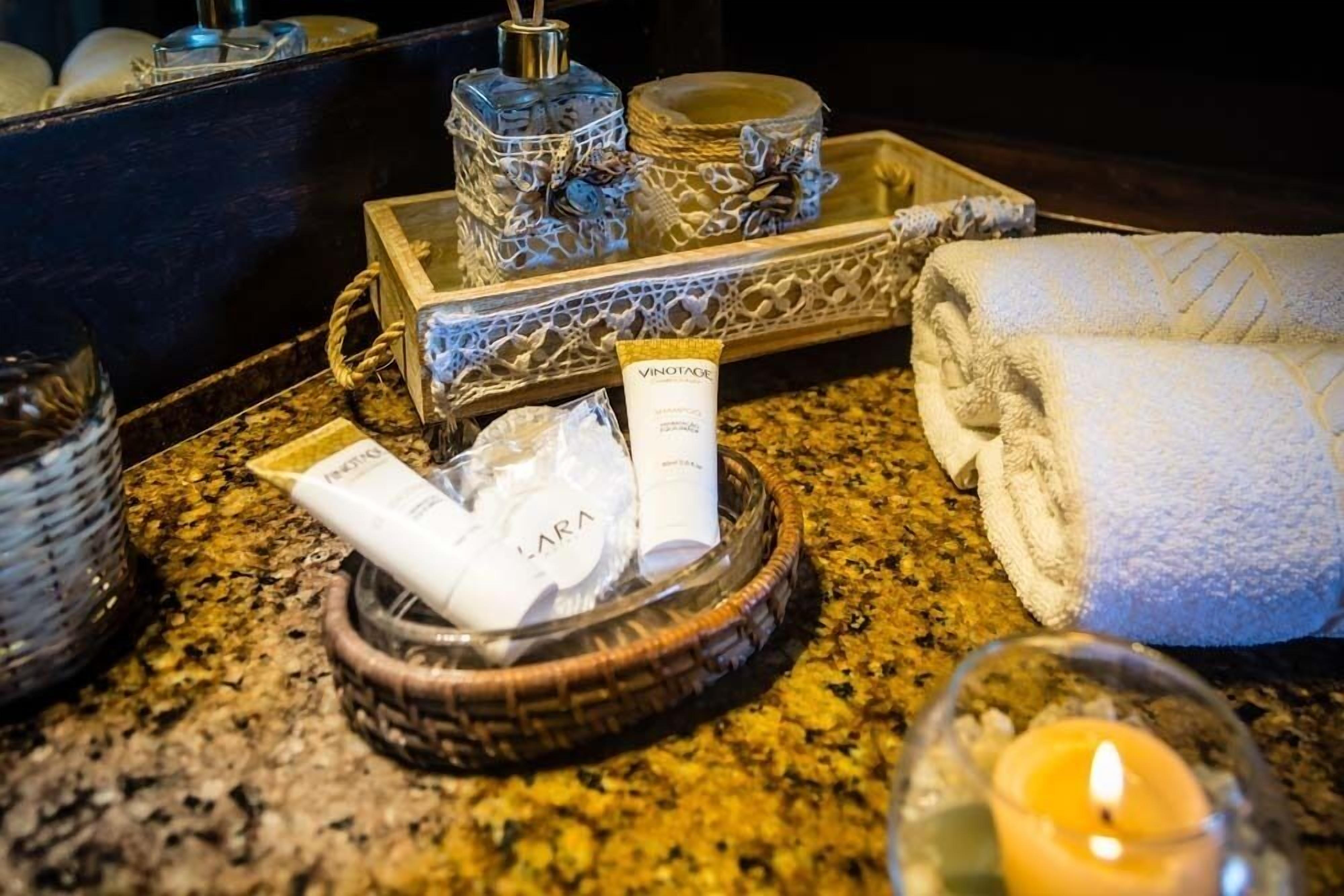 royal suite | bathroom amenities | designer toiletries, hair dryer, towels, soap
