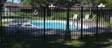 Seasonal outdoor pool, pool loungers