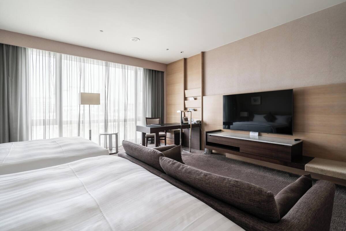 deluxe quadruple room | premium bedding, down duvets, minibar, in-room safe