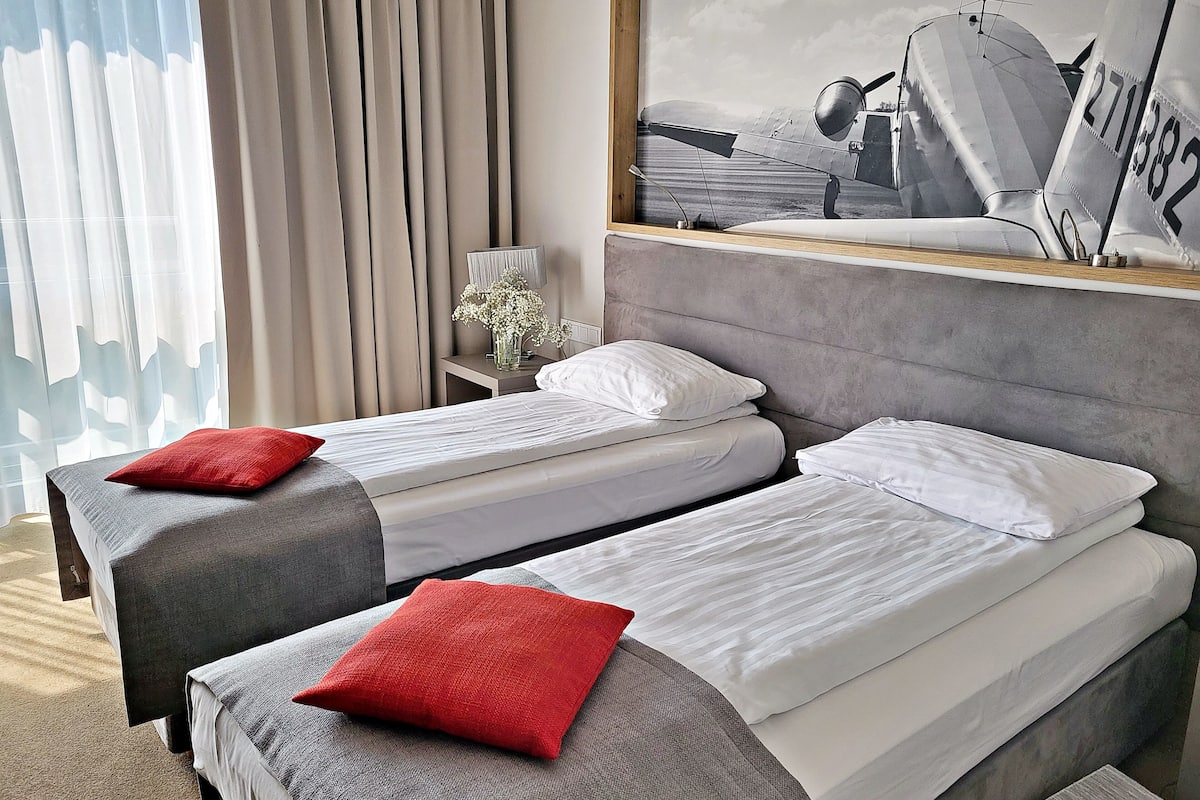 deluxe double or twin room | in-room safe, desk, laptop workspace, soundproofing