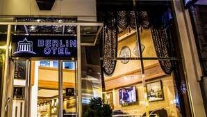 The exterior of the Berlin Hotel with a clear view of the entrance, a signboard, and a large window with decorative curtains. - Berlin Otel Nişantaşı (Istanbul)