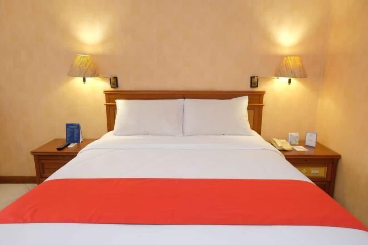 Luxe beddengoed, een kluis op de kamer, een bureau, extra bedden