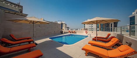 Outdoor pool, open 9:00 AM to 7:00 PM, pool umbrellas, sun loungers