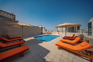 Outdoor pool, open 9:00 AM to 7:00 PM, pool umbrellas, sun loungers