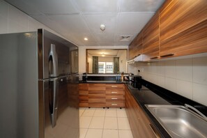 Deluxe Apartment | Private kitchen | Full-size fridge, microwave, stovetop, coffee/tea maker - City Stay Prime Hotel Apartment (Dubai)