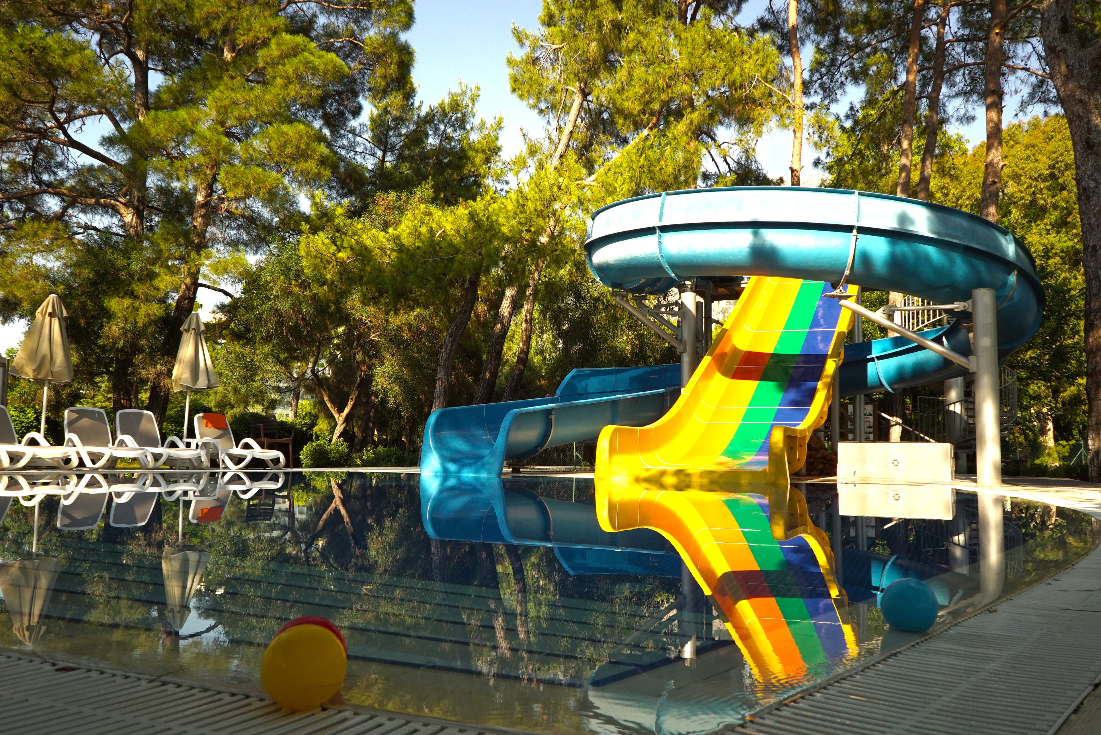 A water park with a water slide and a pool.