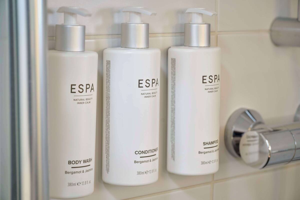 shower, rainfall showerhead, designer toiletries, hair dryer