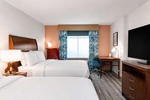 A hotel room with two beds, a desk, a TV, and a window with curtains. - Hilton Garden Inn Wallingford/Meriden (Wallingford)