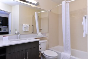 A modern bathroom with a sink, toilet, and bathtub. - Candlewood Suites Casper by IHG (Casper)