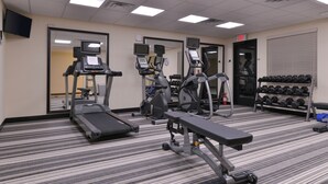 A gym with treadmills, elliptical machines, and a bench. - Candlewood Suites Casper by IHG (Casper)