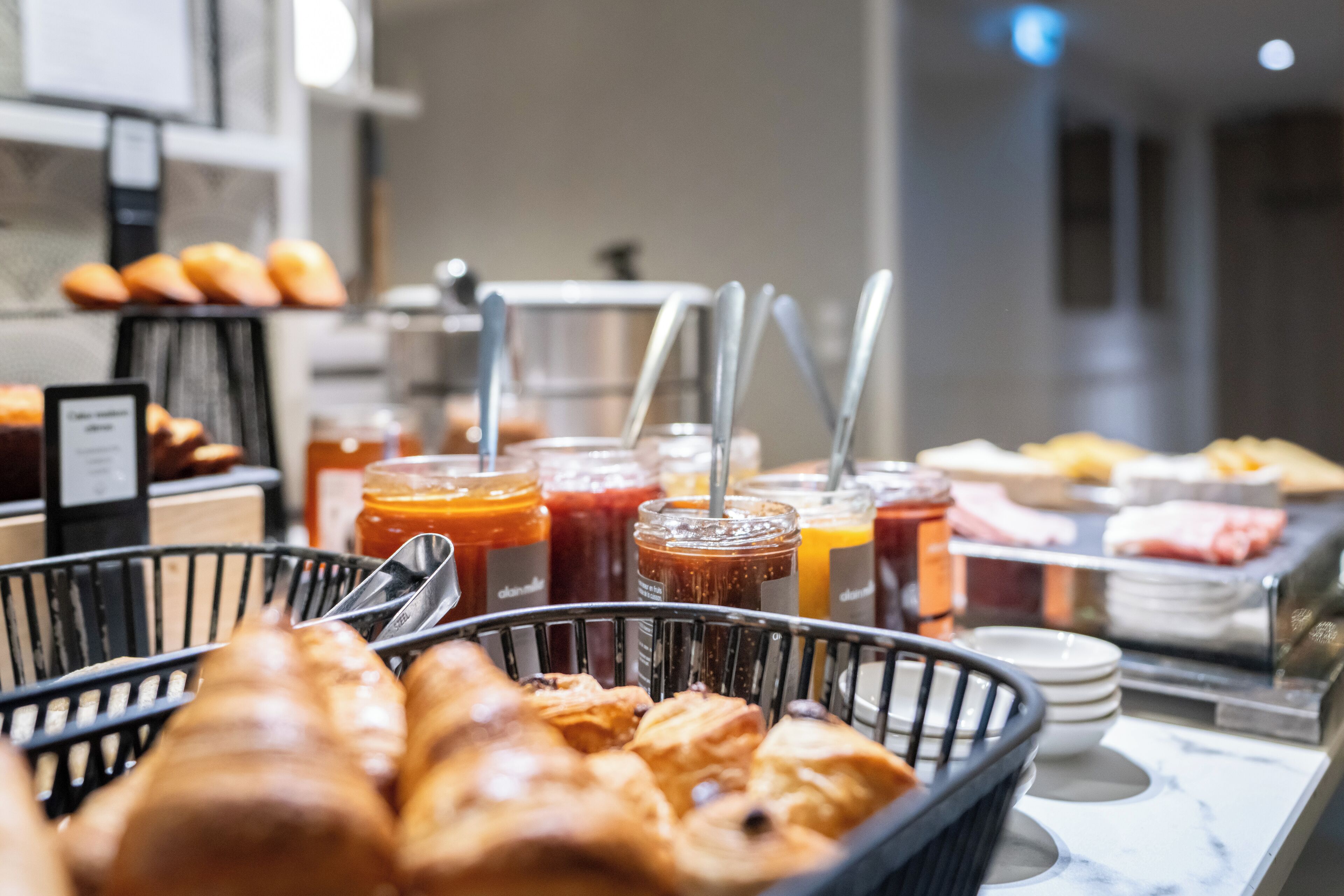 A buffet with various food items and beverages.