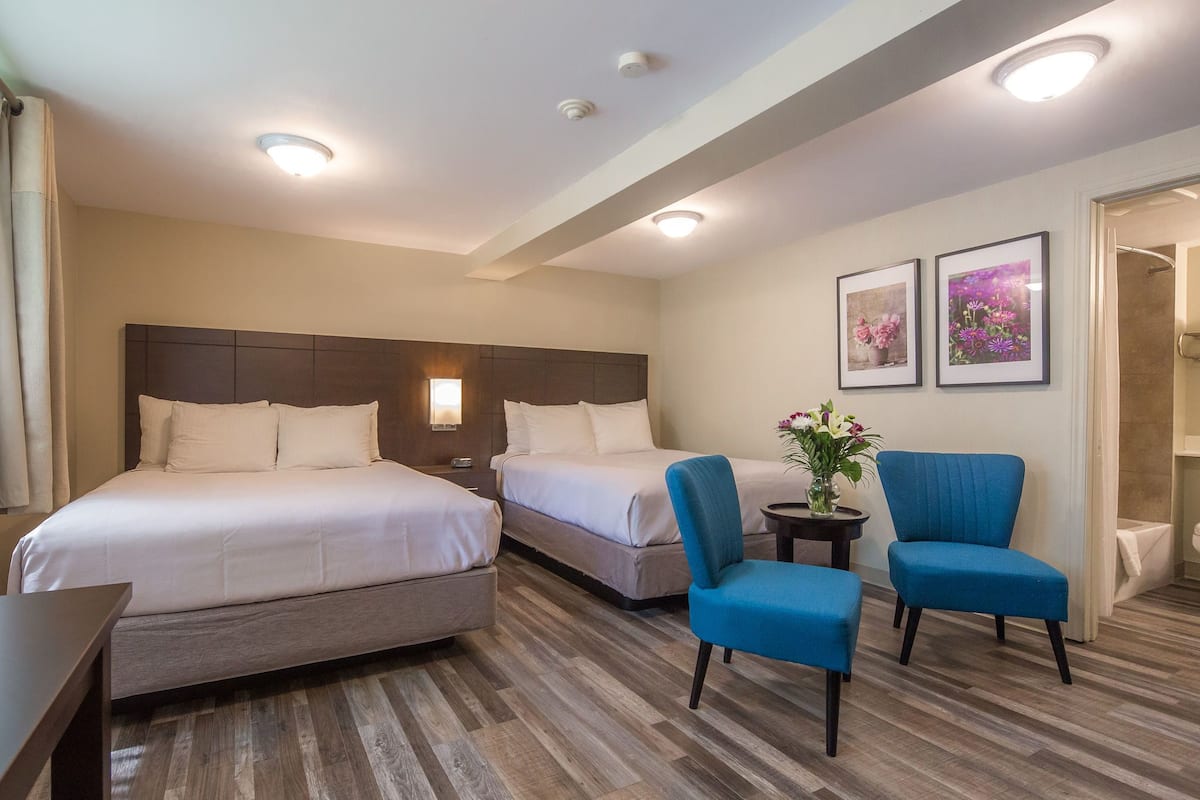 Standard Room, 2 Queen Beds | Iron/ironing board, WiFi (free), bed sheets