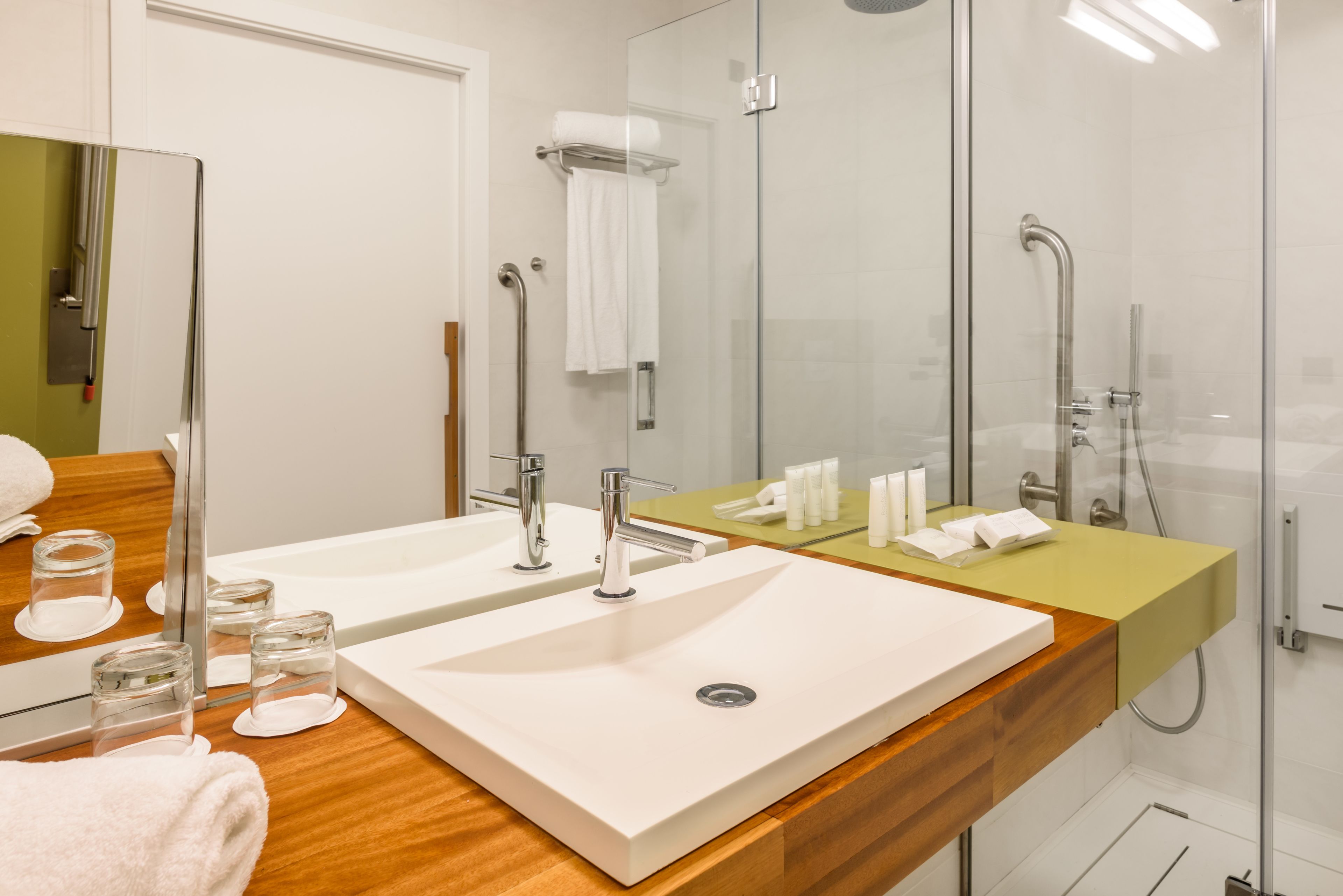 eco-friendly toiletries, hair dryer, towels