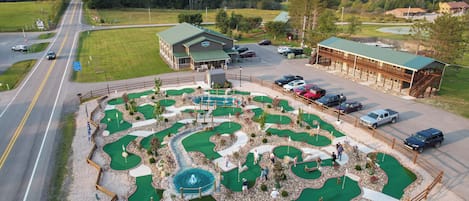 A golf course with a building labeled 'RENN'S' in the background.
