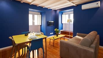 Apartment, 1 Bedroom | Living room | Flat-screen TV