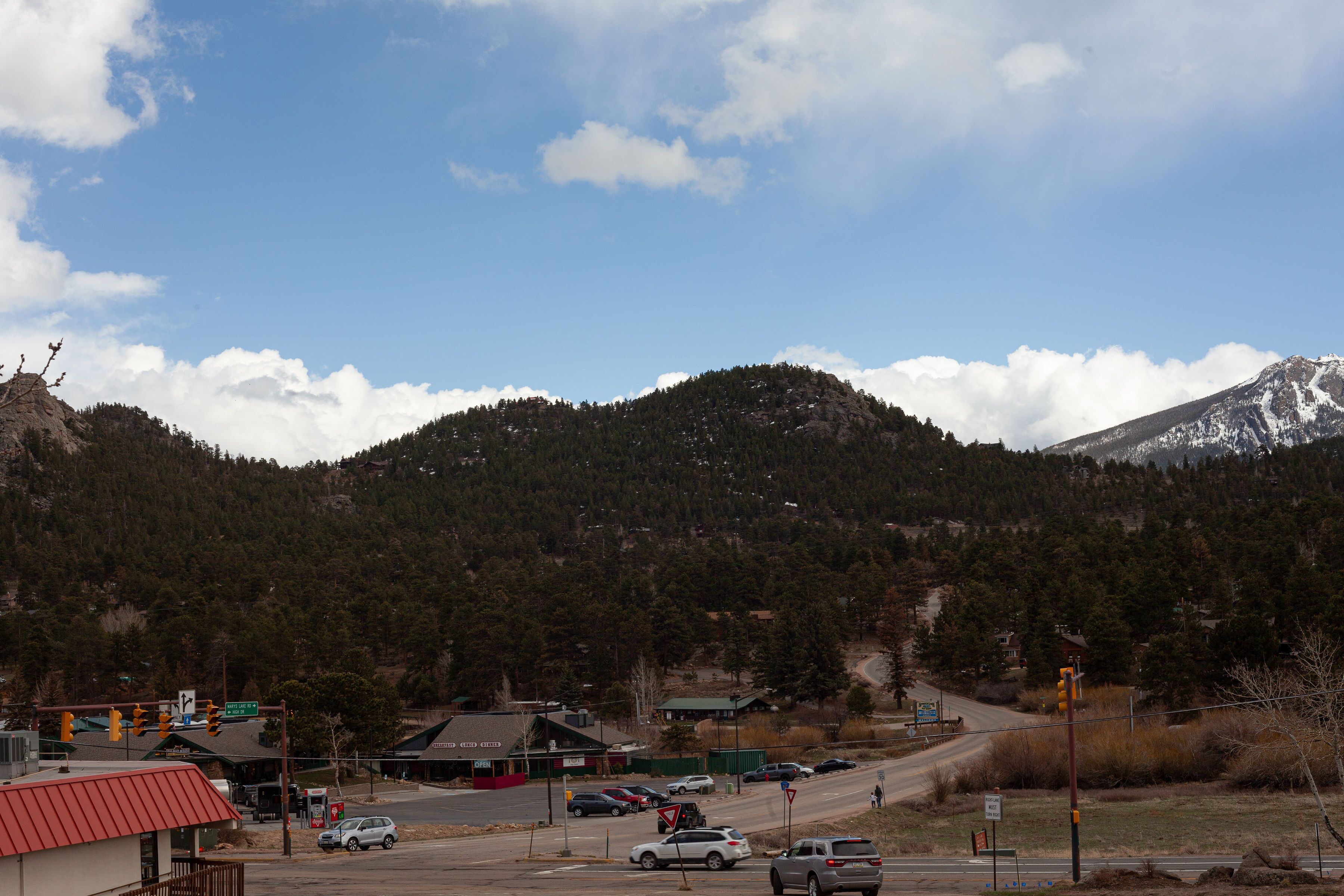 A mountain with a road leading to a small town.
