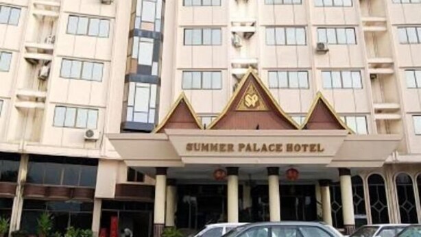 A multi-story building with a sign reading "Summer Palace Hotel." - Summer Palace Hotel (Yangon)